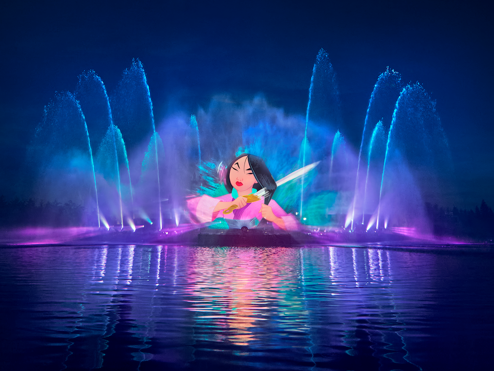Mulan projected onto illuminated water fountains during a nighttime show at Disneyland Paris